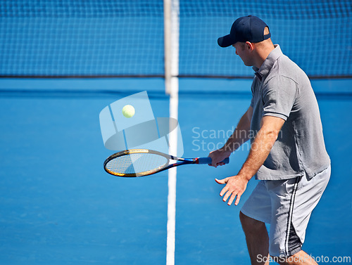 Image of Athlete, man and tennis on court with serve, competition and performance outdoor with fitness and energy. Sport, player and ball on turf for training, exercise and racket with skill, game and hobby