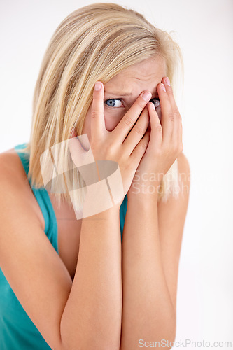 Image of Terror, portrait and woman with hands on face, scared and confused with trauma in horror studio. Panic, scary danger and shocked embarrassed girl with stress, anxiety and fear on white background.