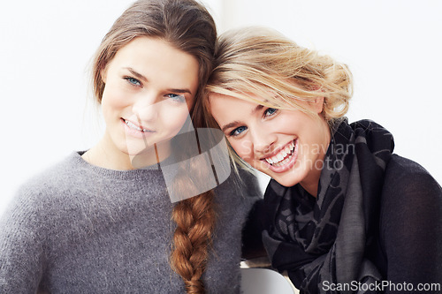 Image of Women, friends and fashion in portrait in studio with style, support and solidarity by white background. Girl, people and happy together with smile, relax and bonding with care, love or positivity