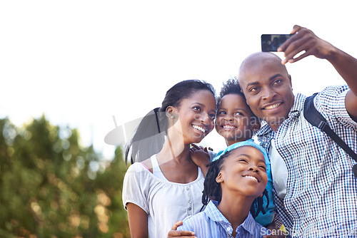 Image of Happy black family, selfie and photography in nature for hiking, bonding or outdoor photo together. African mother, children and father smile taking picture or photograph for adventure in forest