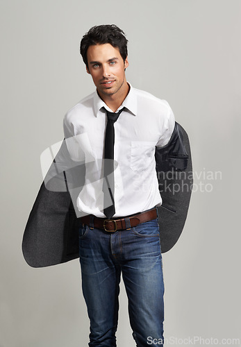Image of Fashion, confident and portrait of man in a studio with formal, elegant and classy outfit with blazer. Cool, handsome and young model from Canada with attractive style isolated by gray background.