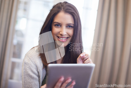 Image of Woman, portrait and tablet for browsing on website, app and scrolling on social media at home. Female person, smile and internet connection for blogging, happy and online communication on technology