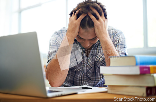 Image of Student, headache and stress for education, college or e learning test, bad results or time management fail. Man with anxiety, depression and confused or frustrated for university research on laptop