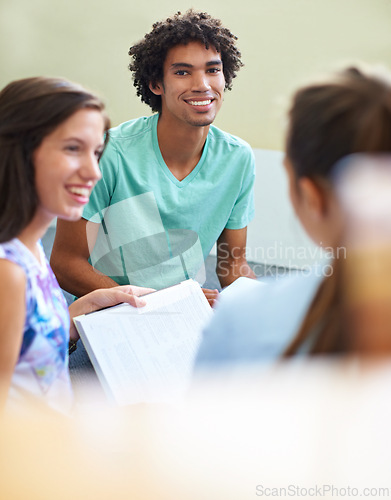 Image of Students, man in portrait and classroom for education, learning and knowledge in university or college. Young people with smile, teacher notes and information for lecture, scholarship or studying