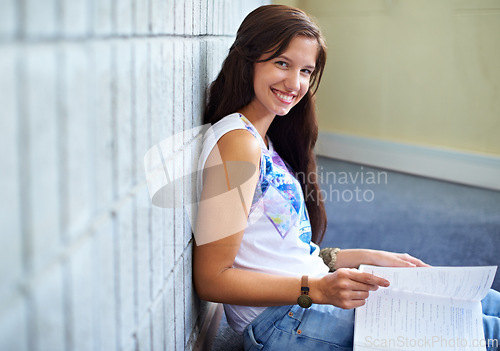 Image of Student, woman and portrait and reading book for education, learning and knowledge in college. Young and smart person with textbook for college research, test or exam script and studying on floor