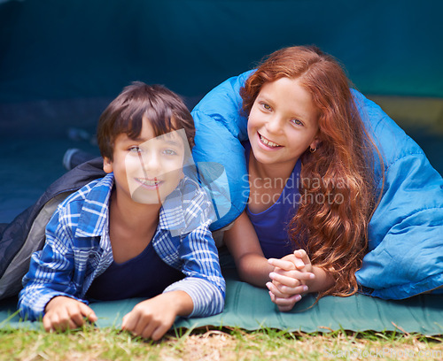 Image of Happy, camping and portrait of children in sleeping bag for resting, relax and comfortable in tent. Travel gear, smile and kids in sleep sack for adventure on holiday, vacation and weekend outdoors