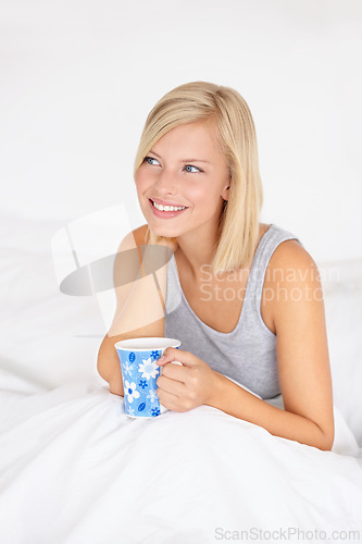 Image of Morning, tea and woman thinking in bed and relax in home planning ideas for future. Girl, drink and smile with coffee in bedroom remember a dream on holiday or vacation with peace in apartment