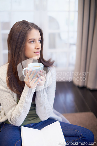 Image of Woman, thinking and coffee in living room, daydream or future for inspiration and journal in apartment. Calm, thoughtful and insight, mindfulness with tea for ideas or memory at home with notebook
