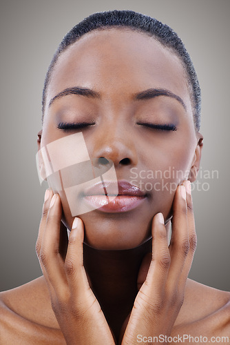 Image of Face, beauty and relax with natural black woman in studio on gray background or wellness aesthetic. Skincare, makeup and cosmetics with young person at spa for facial treatment or dermatology