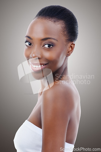 Image of Skincare, dermatology and portrait of black woman in studio with smile, natural makeup or facial glow. Cosmetics, beauty and face of happy girl on grey background for healthy skin, shine or wellness.