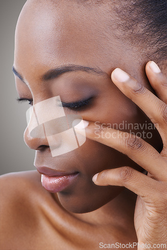 Image of Skincare, beauty and black woman closeup with nails for self care in studio background or salon. Facial, makeup and African model with natural glow on skin and hand from cosmetics or dermatology