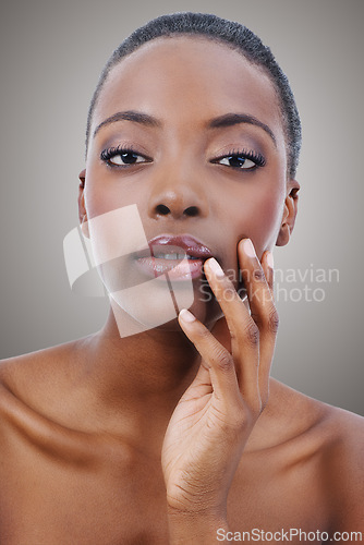 Image of Beauty, portrait and black woman with makeup and skincare in studio, background or salon. Nails, facial and African model with healthy natural glow on skin and hand from cosmetics or dermatology