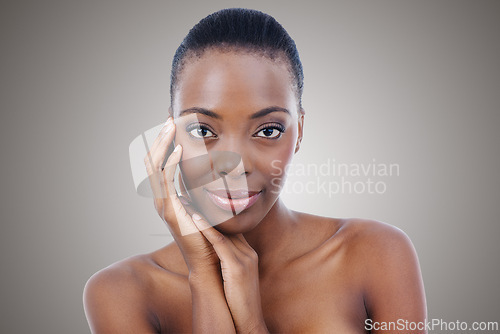 Image of Woman, portrait and facial skincare or health in studio or natural beauty, cosmetics or self care. Black person, model and confident or dermatology treatment on grey background, Kenya or mockup space