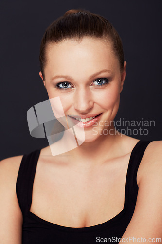 Image of Happy woman, portrait and makeup in studio for beauty, shine or wellness treatment on black background. Cosmetic, face and female model with glowing skin confidence, smile or result satisfaction