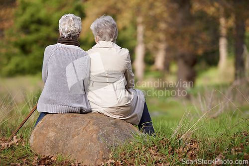 Image of Senior women, retirement and back in nature, support and bonding together in outdoors. Elderly people, friendship and trust in garden or park, care and relaxing on vacation or travel for holiday