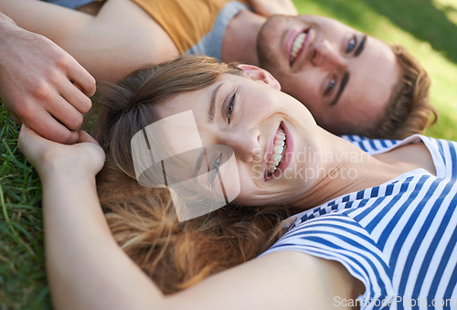 Image of Lawn, love and portrait of happy couple relax for summer sunshine, wellness or weekend break for outdoor leisure. Smile, care and face of boyfriend, girlfriend or people lying on grass pitch together