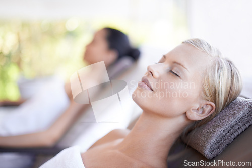 Image of Spa, woman and wellness on massage bed with relax for skincare, zen and beauty treatment for body care. Person, sleeping and physical therapy at resort, salon table and luxury on holiday or vacation