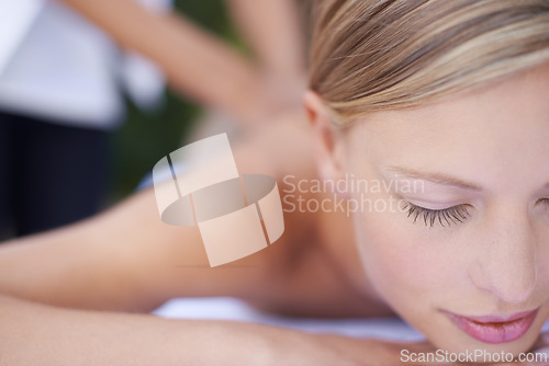 Image of Woman, massage and therapist for wellness, back and spa for treatment and stress relief skincare. Sleeping, masseuse and resting in resort, peaceful and hands for luxury bodycare and tranquility