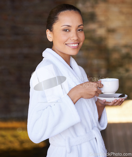 Image of Woman, portrait and spa with morning coffee, hotel and bathrobe from wellness and skincare treatment. Espresso, happy and smile from tea cup and health with hospitality at lodge with luxury and care