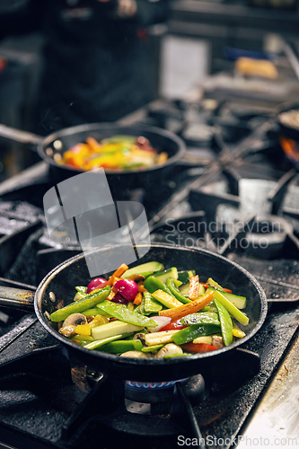 Image of Sliced vegetables in the frying pan