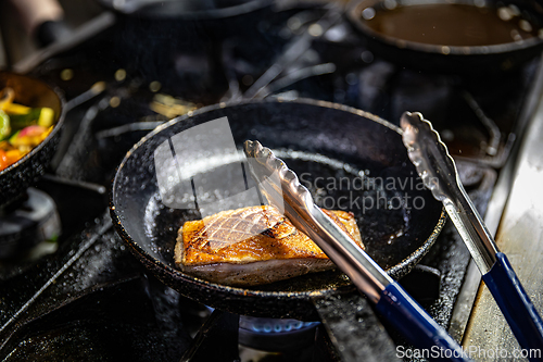 Image of Duck breast cooking on a hot pan