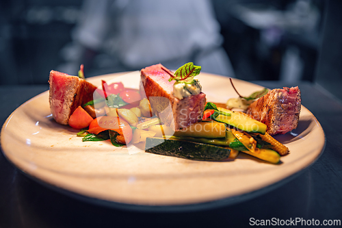 Image of Beef steak slices with grilled vegetables