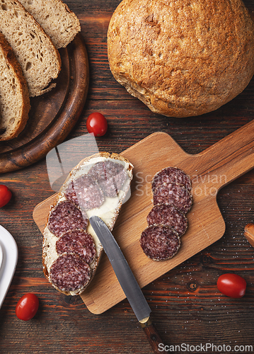 Image of Open sandwich of salami slices