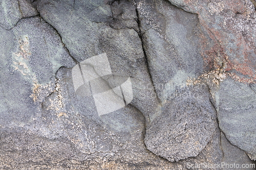 Image of A detailed view of a weathered rock surface showing natural patterns and textures.