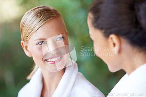 Image of Women, friends and spa with morning, hotel and bathrobe from wellness and skincare treatment. Relax, happy and smile from bonding and people with hospitality at lodge with luxury care outdoor