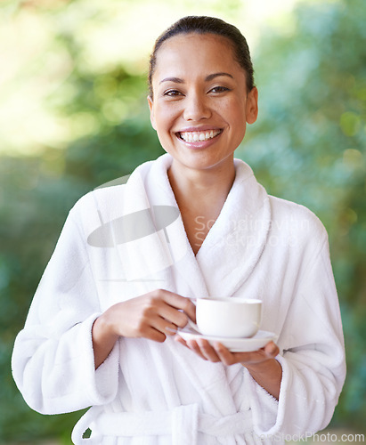 Image of Woman, portrait and spa outdoor with coffee, hotel and bathrobe from wellness and skincare treatment. Espresso, happy and smile from tea cup and health with hospitality at lodge with luxury and care