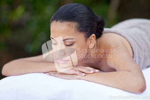 Image of Spa, woman and sleeping on massage bed with break for wellness, zen and beauty treatment for body care. Person, relax and natural self care at resort, salon table and luxury on holiday or vacation