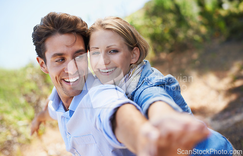 Image of Couple, portrait and happy outdoor with freedom in relationship for holiday, vacation or travel. Romance, man and woman with smile in nature or forest with embrace for bonding, love or relax in woods