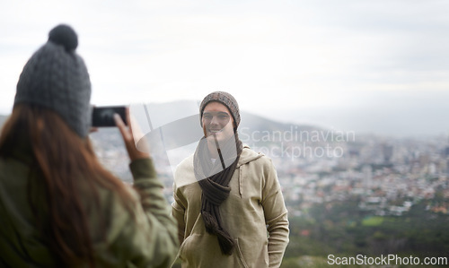 Image of Happy man, couple and phone photo of nature on hiking memory, trekking adventure or journey on mountain trip. Cellphone, travel photography and outdoor people post profile picture to social media app