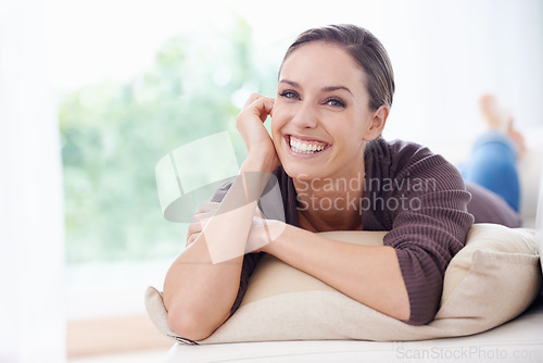 Image of Woman, happy and portrait for lying on couch for positive, satisfaction and mindset. Relax, calm and weekend with female person, home and joy, carefree and comfortable alone in sofa for rest