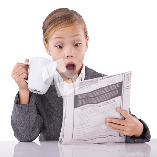 Image of Young child, reading and newspaper headlines in studio with shock for business, coffee and surprise of daily events. Little girl, suit or thinking by mug as pretend professional or white background