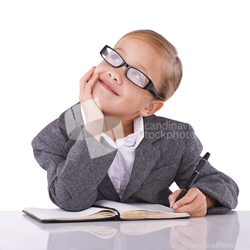 Image of Young child, writing and dreaming in studio for business, career and happy with idea of office job. Little girl, suit or positive for future as pretend accountant or cute glasses by white background