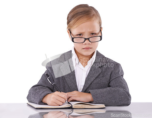 Image of Business person, notebook and child in portrait, writing ideas and planning tasks in studio. Serious female person, pretend employee and journal for notes, schedule and diary on white background