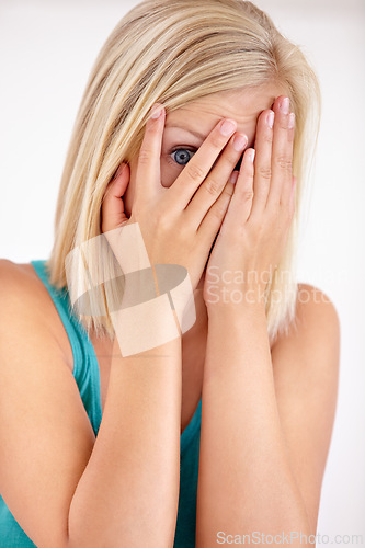 Image of Fear, portrait and woman with hands on face, scared and confused with trauma in horror studio. Panic, scary danger and shocked embarrassed girl with stress, anxiety and terror on white background.