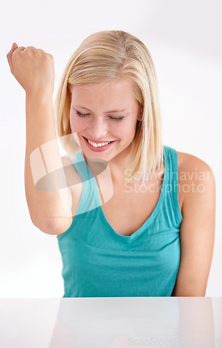 Image of Happy, celebrate and woman punching air for achievement, success and bonus announcement in studio. Winning dance energy, deal and excited girl with fist up in celebration isolated on white background