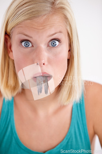 Image of Surprise, woman and portrait eating fish with shock on white background of studio. Wow, crazy and person on diet with fear of weird seafood, cuisine and disgust in mouth for gross, tail and food