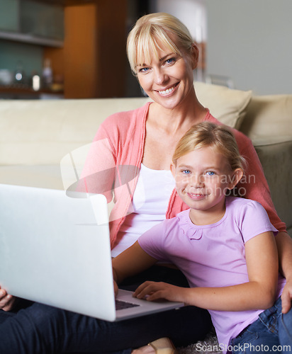 Image of Mother, child and laptop in portrait in living room, happy and streaming subscription in apartment. Daughter, woman and face by computer for online cartoon on couch, technology and connected in house