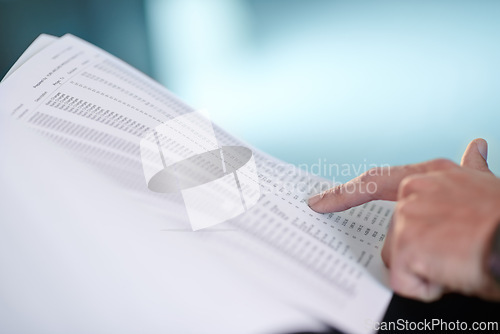 Image of Hand, pointing at documents and numbers for finance, investment or business profit in corporate office. Accounting, person and paperwork for asset management, figures and reading stocks at workplace
