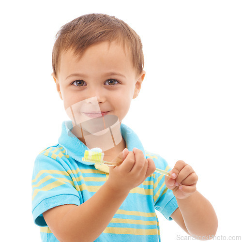 Image of Boy kid, toothpaste and toothbrush for portrait in studio with smile for health, clean or hygiene by white background. Child, happy and learning for brushing teeth, choice or dental wellness routine