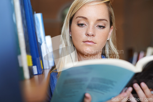 Image of Reading book, face or woman in library at university, college or school campus for future education. Bookshelf, learning or female student with scholarship studying knowledge, research or information