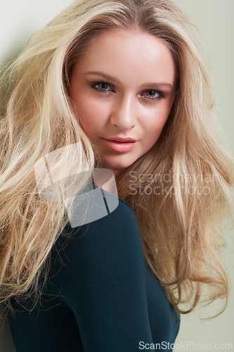 Image of Hair care, portrait and woman in studio with growth, texture or volume on wall background. Face, hairstyle and female beauty model pose with shampoo, treatment or conditioner, shine for results