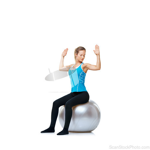 Image of Woman, ball or body balance on a white background space for workout, wellness or mobility exercise. Female athlete training, hands up or fitness for mockup, back posture or flexibility in studio