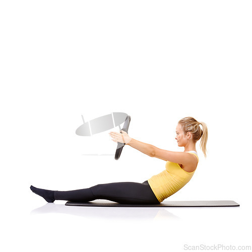 Image of Pilates ring, fitness and woman exercise in studio isolated on a white background mockup space. Training, person on mat and magic circle for roll up, strong abdomen and healthy body workout on floor