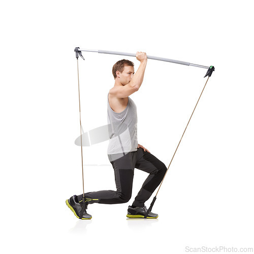 Image of Fitness, workout and resistance band with a young man in studio isolated on a white background for health. Gym, exercise or performance and a strong athlete training with equipment for wellness