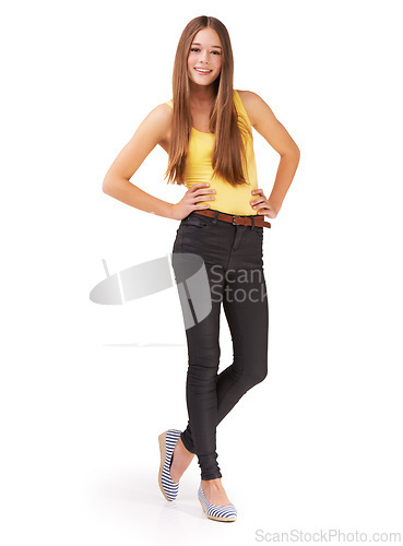 Image of Fashion, confident and portrait of girl on a white background for positive attitude, happy and style. Hands on hips, youth and isolated teenager in trendy clothes, casual outfit and stylish in studio