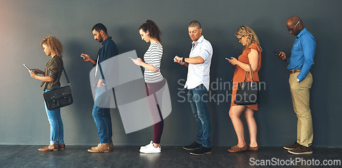 Image of Businesspeople, interview and waiting in queue with technology or job recruitment, onboarding or internet. Men, women and meeting diversity in line or cellphone in office, human resources or hiring